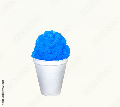 Blue Raspberry Hawaiian Shave Ice, Shaved Ice or a Snow Cone in a white cup on a white background with copy space.