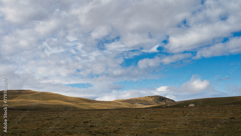 mountain landscape inside the National Parl of Gran Sasso and Monti della Laga during an autumnal and cloudy morning, L'Aquila, Italy     