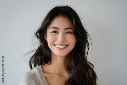Close up photo portrait of smiling beautiful Japanese woman with long dark hair isolated on white background