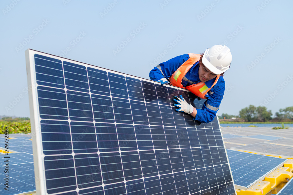Technician Adjusting Solar Panel at Installation Site Technician Adjusting Solar Panel at Installation Site