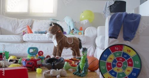 Colorful assortment of children's toys scattered in a bright living room