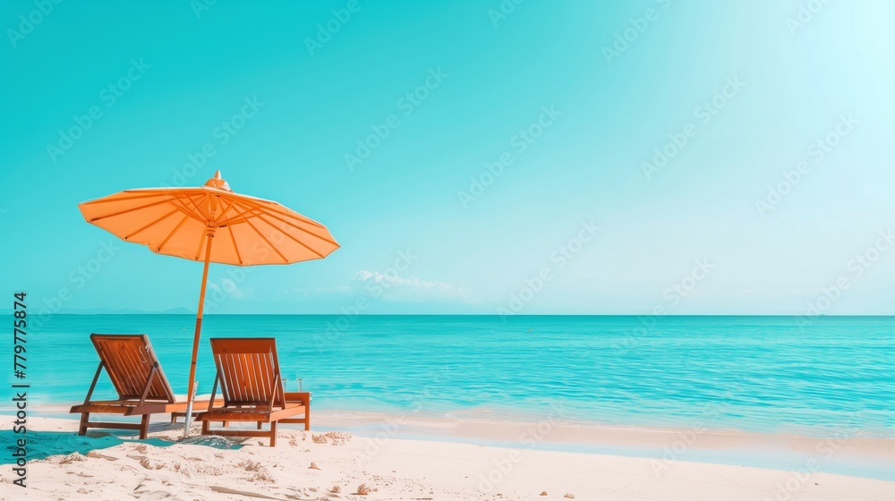 Tranquil beach scene with sun loungers and orange umbrella on white sand