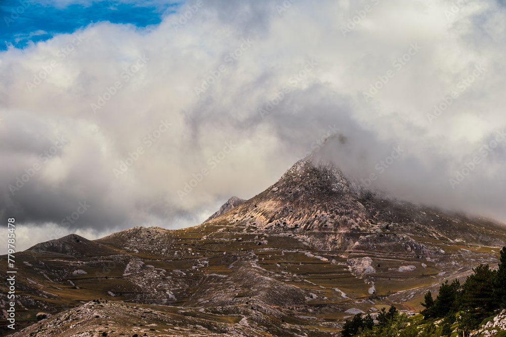 mountain landscape inside the National Parl of Gran Sasso and Monti della Laga during an autumnal and cloudy morning, L'Aquila, Italy     