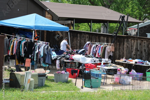 An  alleyway yard sale on a warm Spring day