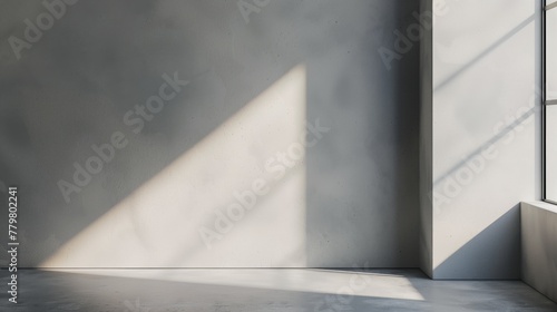 Minimalist interior corner with light casting geometric shadows on wall and floor