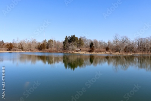 The calm lake in the countryside on a sunny day.