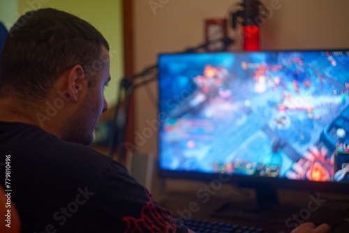 man looking at screen playing video games © Octavio