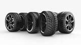 A collection of five different car tires showcasing various tread designs and sizes, isolated on a white backdrop