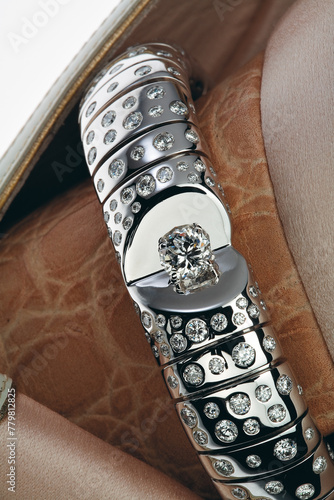Moscow, Russia- February 15, 2006 : Diamond bracelet on the wide leather heel of a woman's shoe. Selective focus
