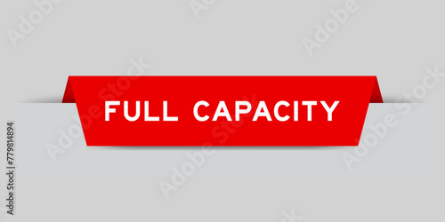 Red color inserted label with word full capacity on gray background photo