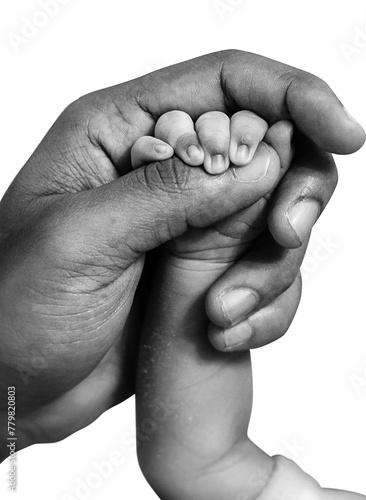 father holding his newborn son's hand