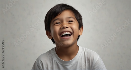 young filipino child boy on plain bright white background laughing hysterically looking at camera background banner template ad marketing concept from Generative AI photo