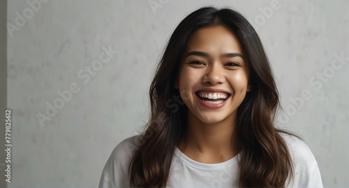 young filipino woman on plain bright white background laughing hysterically looking at camera background banner template ad marketing concept from Generative AI photo