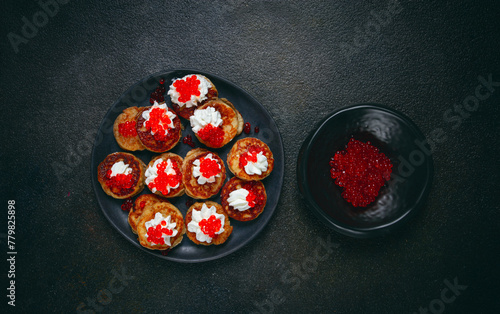 Demidoff pancakes, mini pancakes, with sour cream and red caviar, crepes. homemade, no people, photo