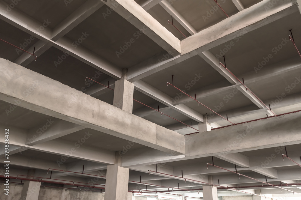 A cement structure inside an unfinished building A cement structure inside an unfinished building