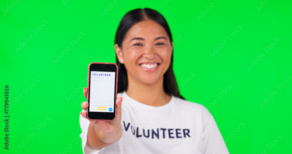 Phone, green screen and portrait of volunteer woman with charity website fund information mockup. Asian person hand with smartphone and tshirt for nonprofit contact, NGO or donation tracking markers Phone, green screen and portrait of volunteer woman with charity website fund information mockup. Asian person hand with smartphone and tshirt for nonprofit contact, NGO or donation tracking markers