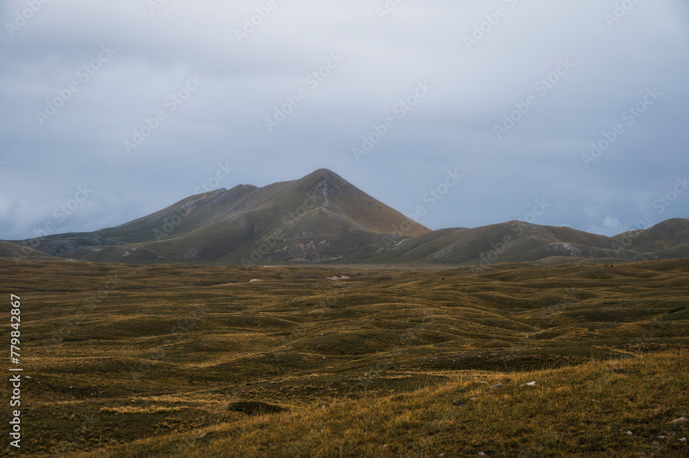 landscape inside Campo imperatore during an autumnal cloudy day, Parco nazionale del Gran Sasso, L'Aquila, Italy landscape inside Campo imperatore during an autumnal cloudy day, Parco nazionale del Gran Sasso, L'Aquila, Italy