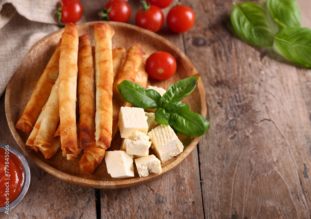 traditional cigar borek with sauce and salad traditional cigar borek with sauce and salad