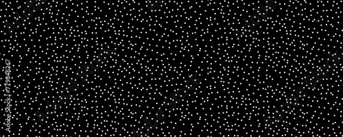 Seamless polka dot pattern: Vector illustration of small white circles on a vintage black backdrop. Creative texture of random, hand-drawn round shapes. Dotted wrapping paper sample