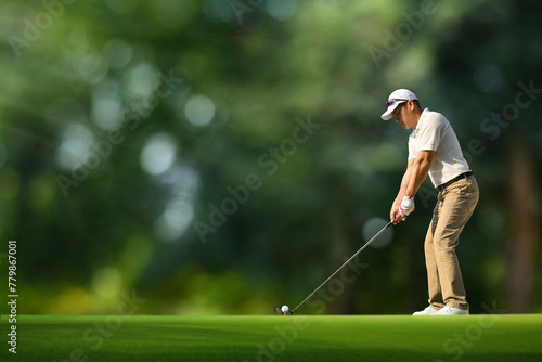 Golfer ready tee-off with drivers on golf teeing ground.