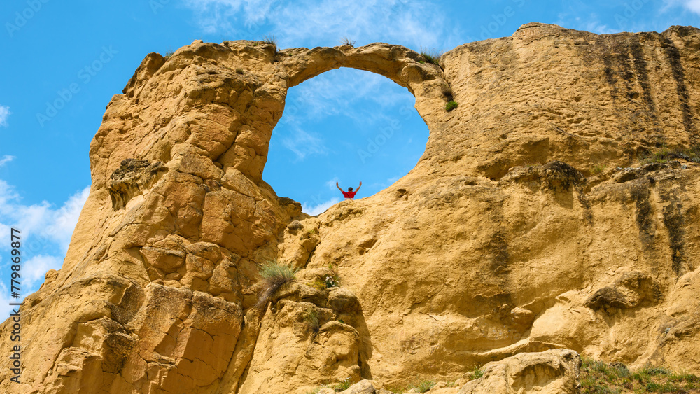 Mountain Ring in Kislovodsk, Stavropol Krai, Russia. Scenery of hole rock, Koltso in Russian and sky in summer, view of window shape and person. Concept of nature in Mineral Waters