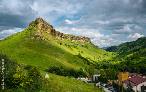 Mountain landscape at Honey Waterfalls canyon near Kislovodsk, Russia. View of scenic green forest and sky in Russian Kavkaz in summer. Concept of nature, travel in Caucasian Mineral Waters