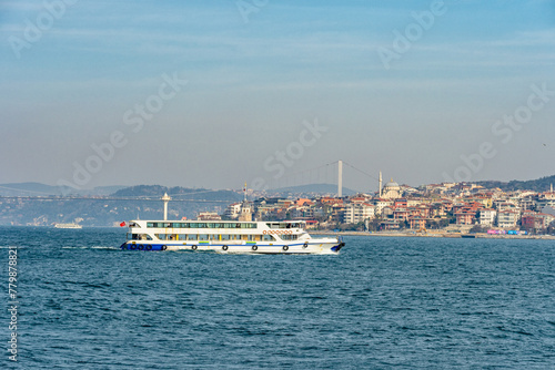 View of Bosphorus Bridge and boats in Istanbul, Turkey.