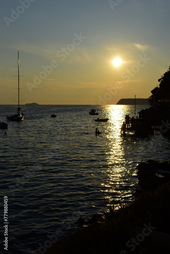 Dubrovnik, Croatia - August, 26 2021: A beautiful sunset at sunset beach at Lapad beach. photo