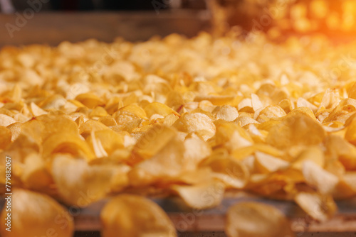 Production line for Potato chips, modern food plant for snacks © Parilov
