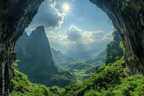 A stunning photograph of the sun shining through the entrance to Wumeng Mountain's cave, with green mountains and lush vegetation visible outside. Created with Ai