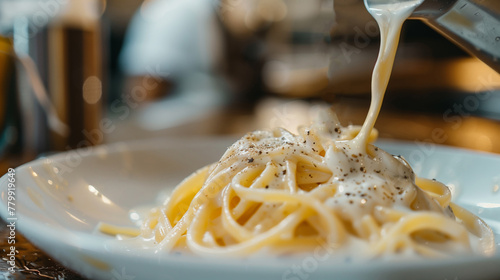 Italian pasta fettuccine alfredo, sause on plate Closeup