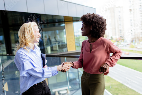 Two Professional Women Shar...