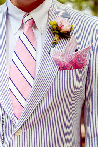 Groom in pink and blue seersucker suit