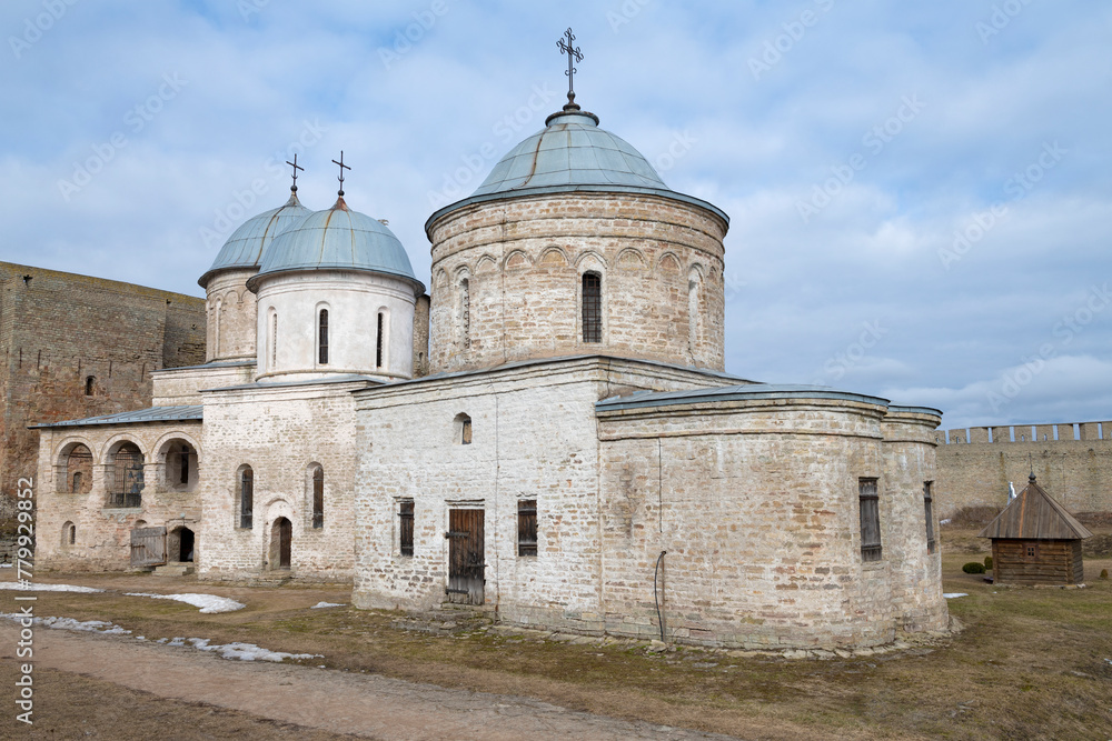 Ancient Assumption and St. Nicholas churches on a cloudy March day. Ivangorod fortress. Leningrad region, Russia