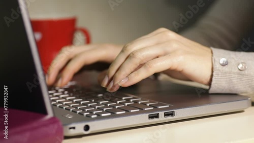 hand typing on a laptop