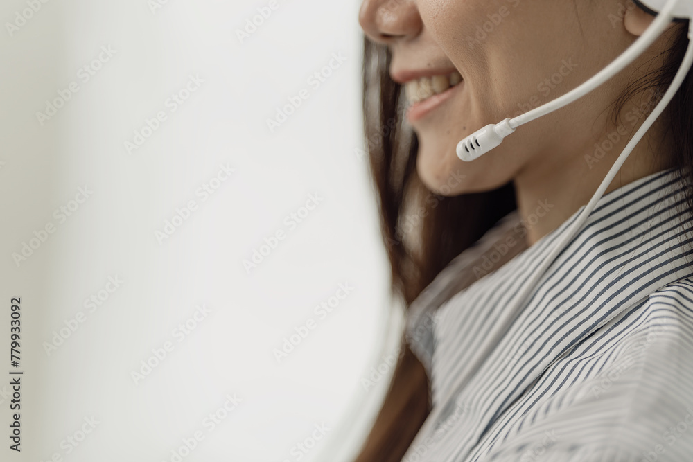 Young Asian woman, consultant and call center on computer in customer service, support or advice, professional representative wearing headphones to contact us or e-commerce on laptop