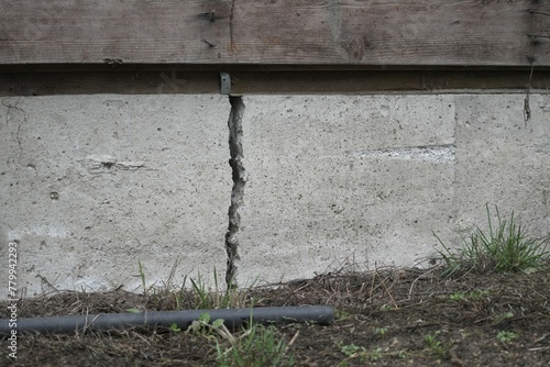 Close-up of a deep residential house foundation crack.