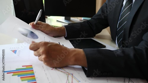 businessman hand doing anlysis planning business project on office