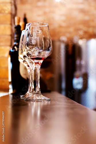 Empty glass glasses after wine tasting in a wine cellar, soft focus.