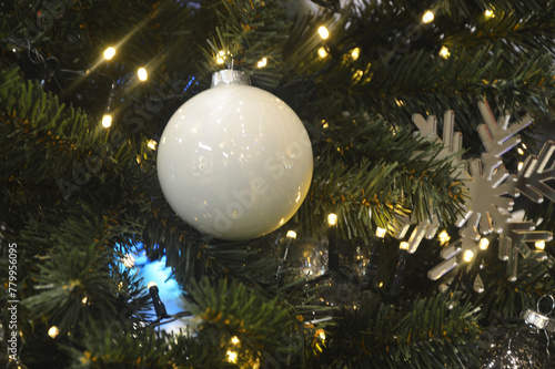 Christmas background - white ball and baubles and evergreen fir branches