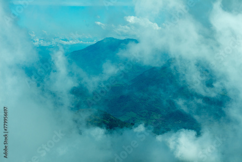 Bright panorama of the cloudy Andes Mountains from the Cerro las Nubes, Mount of the Clouds, in Jerico, Jericó, Antioquia, Colombia. Blue sky whith clouds and mist. photo