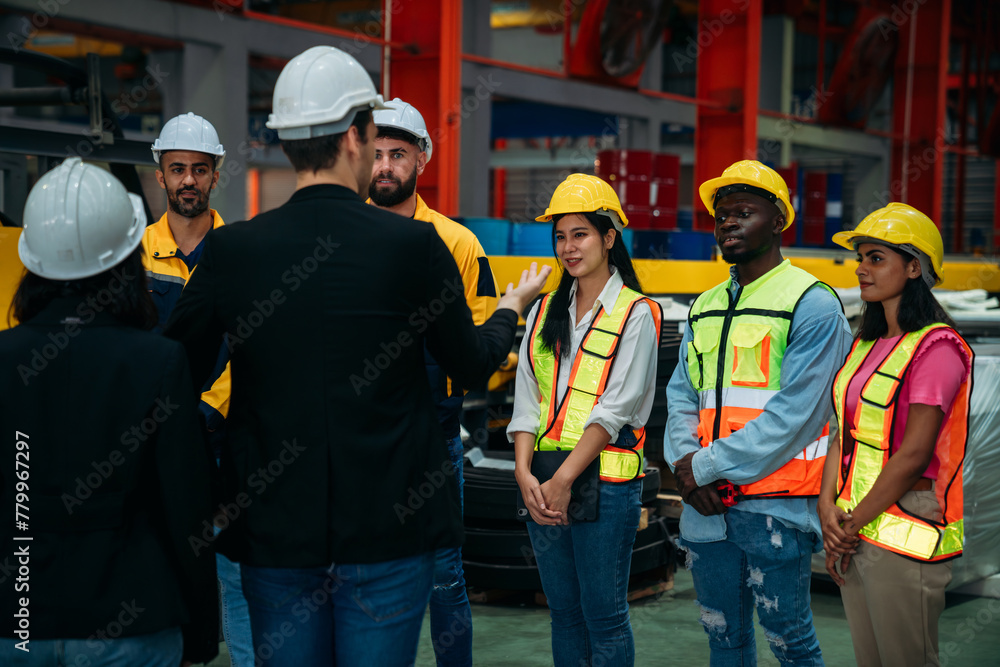 Team engineers and foreman stack hand and shake hands to show success at factory machines. Worker industry join hand for collaboration.. Team engineers and foreman stack hand and shake hands to show success at factory machines. Worker industry join hand for collaboration..