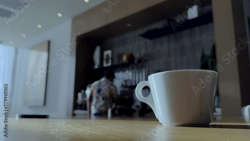 Wallpaper Mural White cup of coffee on the table. Background of a blurred bar. Torontodigital.ca