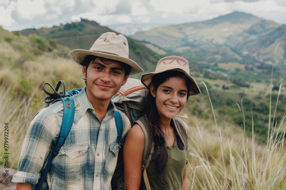 Portrait of a young couple hiking through the mountains
