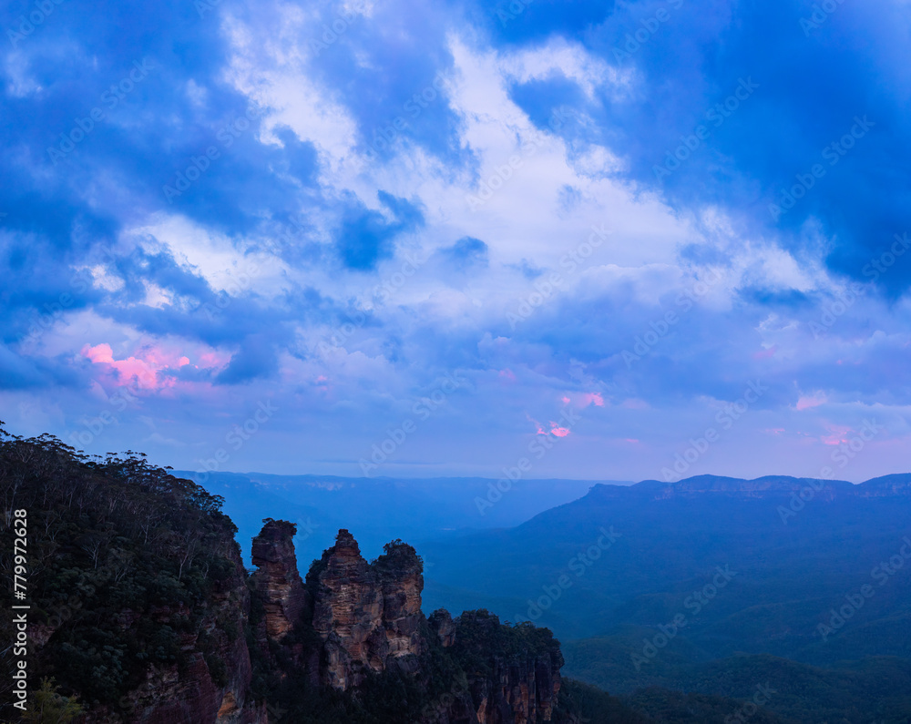 Dramatic clouded dusk sky over The Three Sisters in Blue Mountains Dramatic clouded dusk sky over The Three Sisters in Blue Mountains