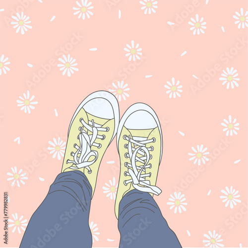 Legs in blue pants and yellow sneakers