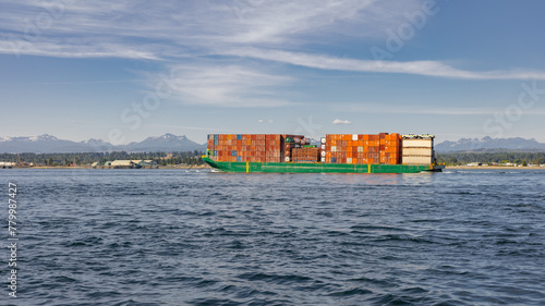 Large Cargo ship carrying industrial containers on the sea
