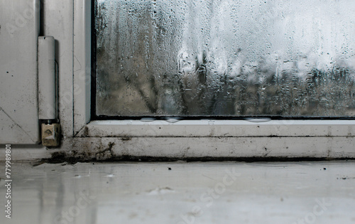condensation on the window. water flows down from the window glass © Olena Vasylieva