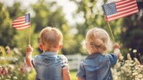 Two toddlers holding American flags in a garden. Rear view of children with patriotic symbols.