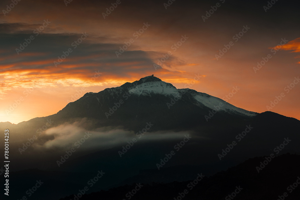 huge mountain silhouette with sunset light view 
